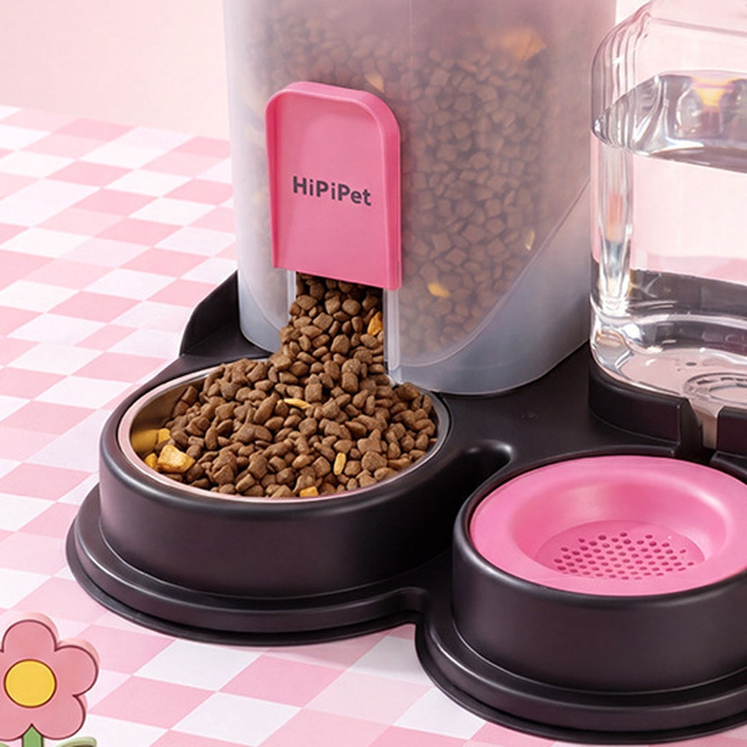 Black pink pet feeder close-up of stainless steel food bowl and kibble chute