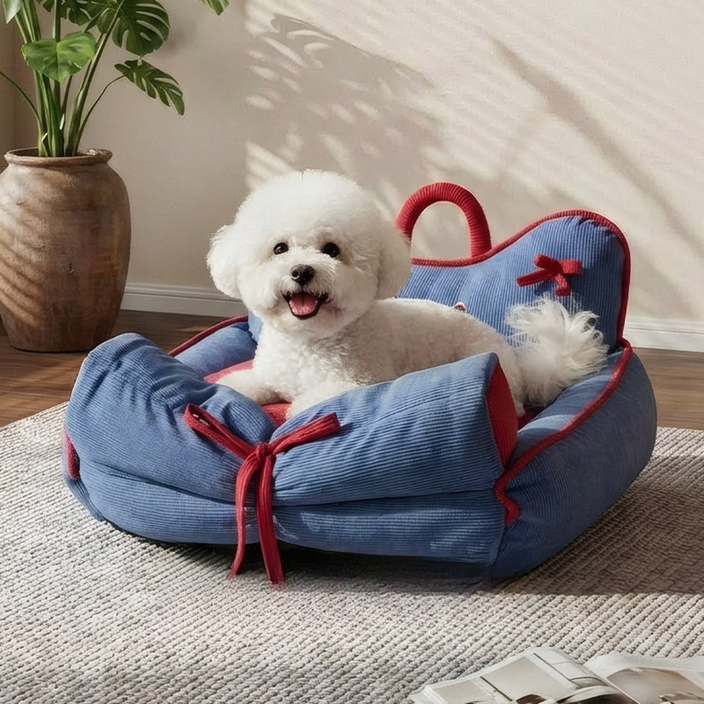 Blue corduroy pet sofa bed with small dog