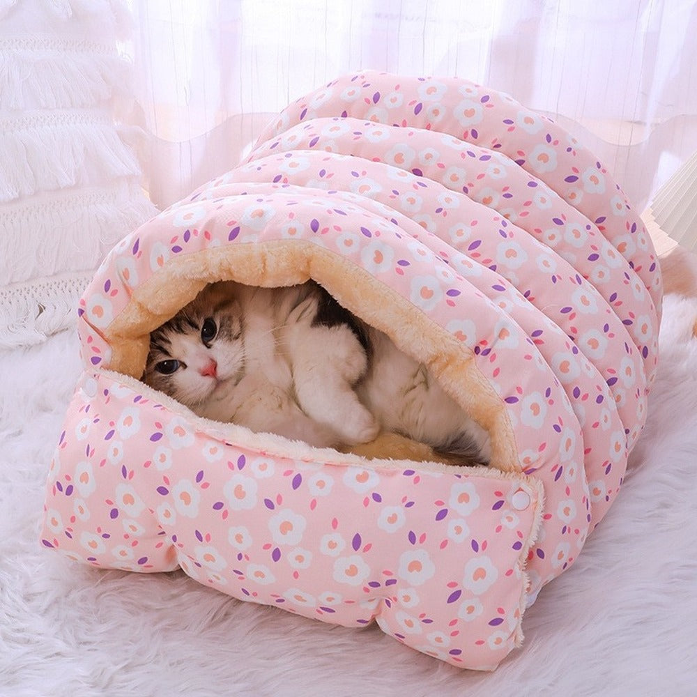 Pink floral cat burrow bed with cat inside