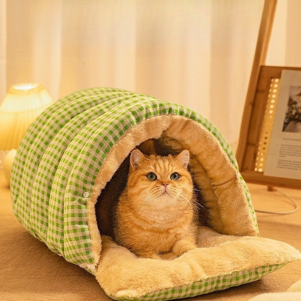 Green plaid cat cave bed with flap open as a mat