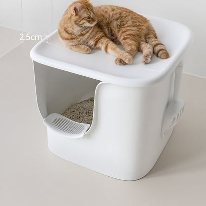 Cat lounging on the lid of an extra large white semi-enclosed litter box
