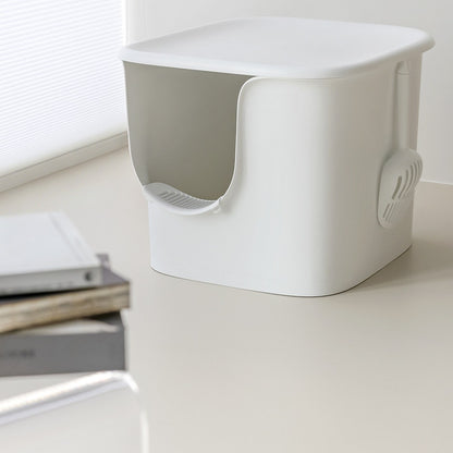 White semi-enclosed cat litter box with scoop holder