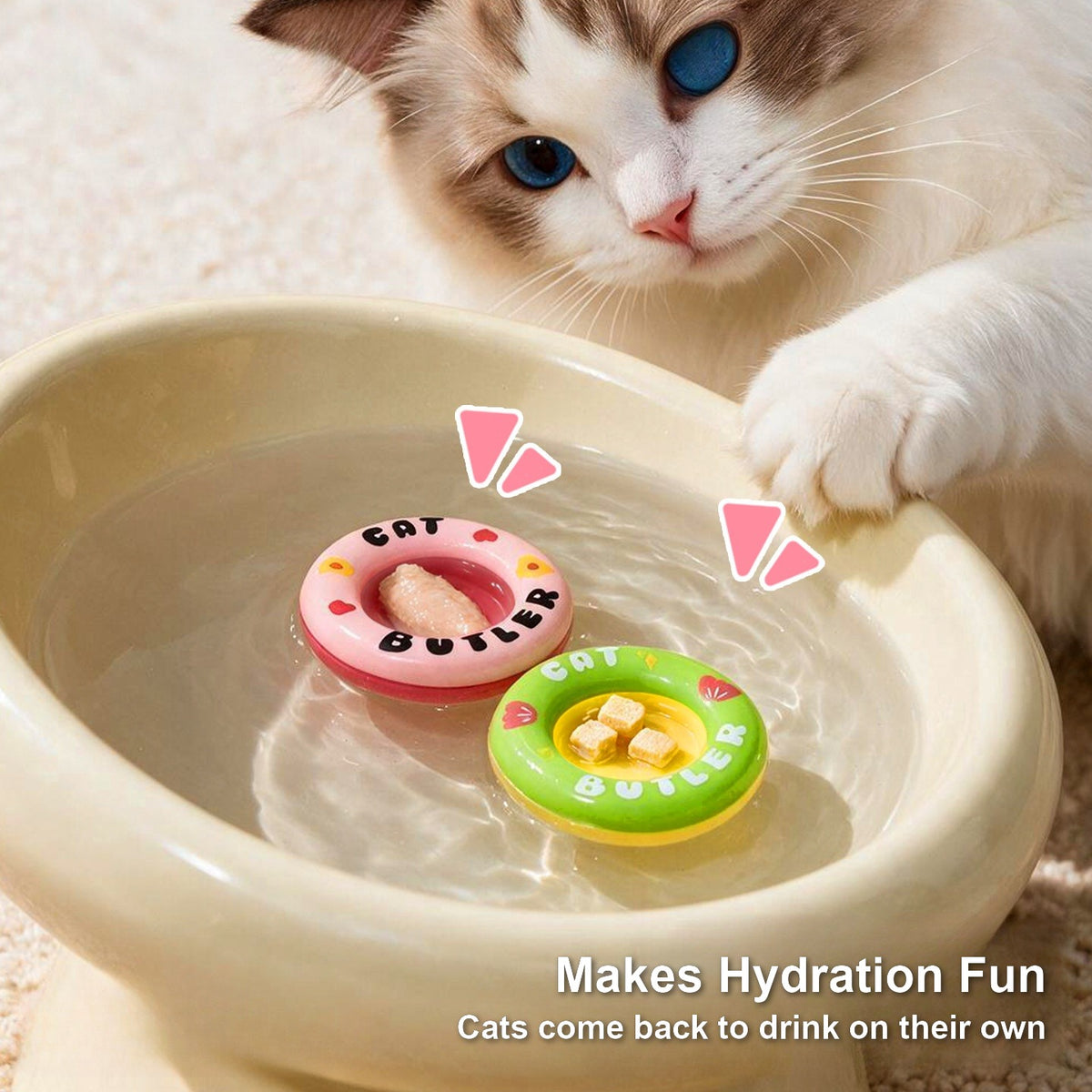 Pink and green floating swim rings in a cat water bowl