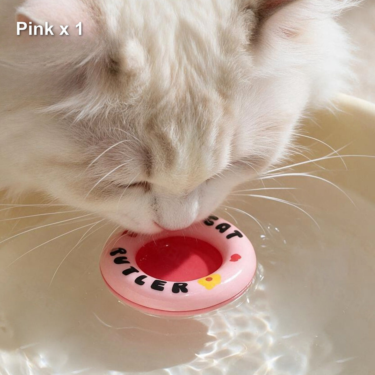 Pink floating cat water ring in use