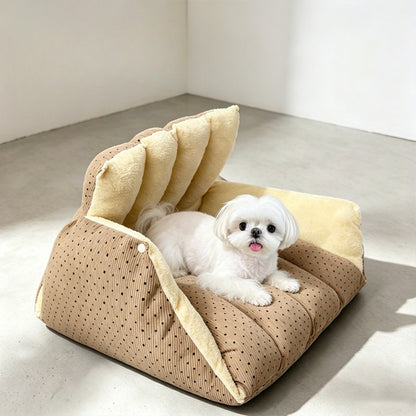 Cat tent unsnapped and folded flat into an open pet bed with headrest