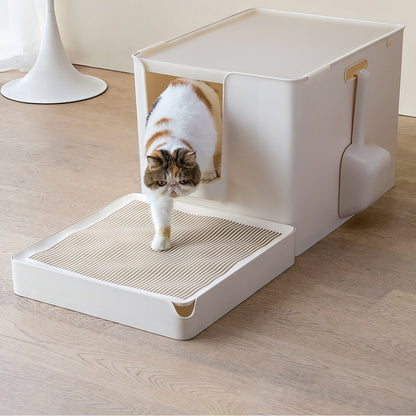 Cat stepping out of the litter box onto the wave-grate platform