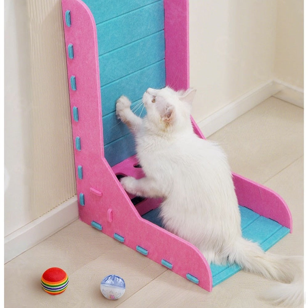 Cat scratching the tall felt wall of the pink L-shaped scratcher