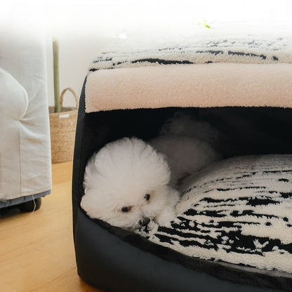 Dog resting on cushion inside plush pet house