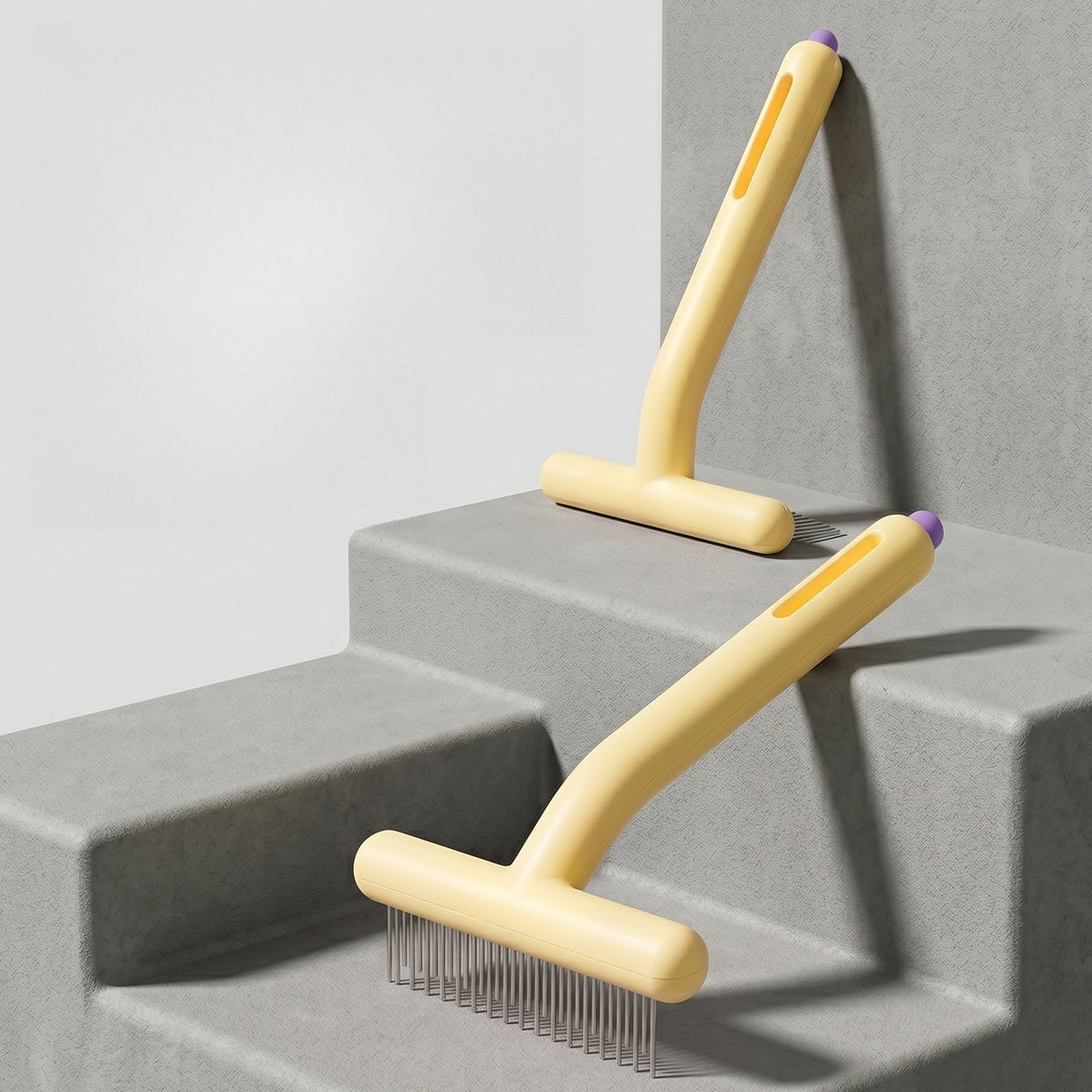 Two rake combs resting on concrete steps